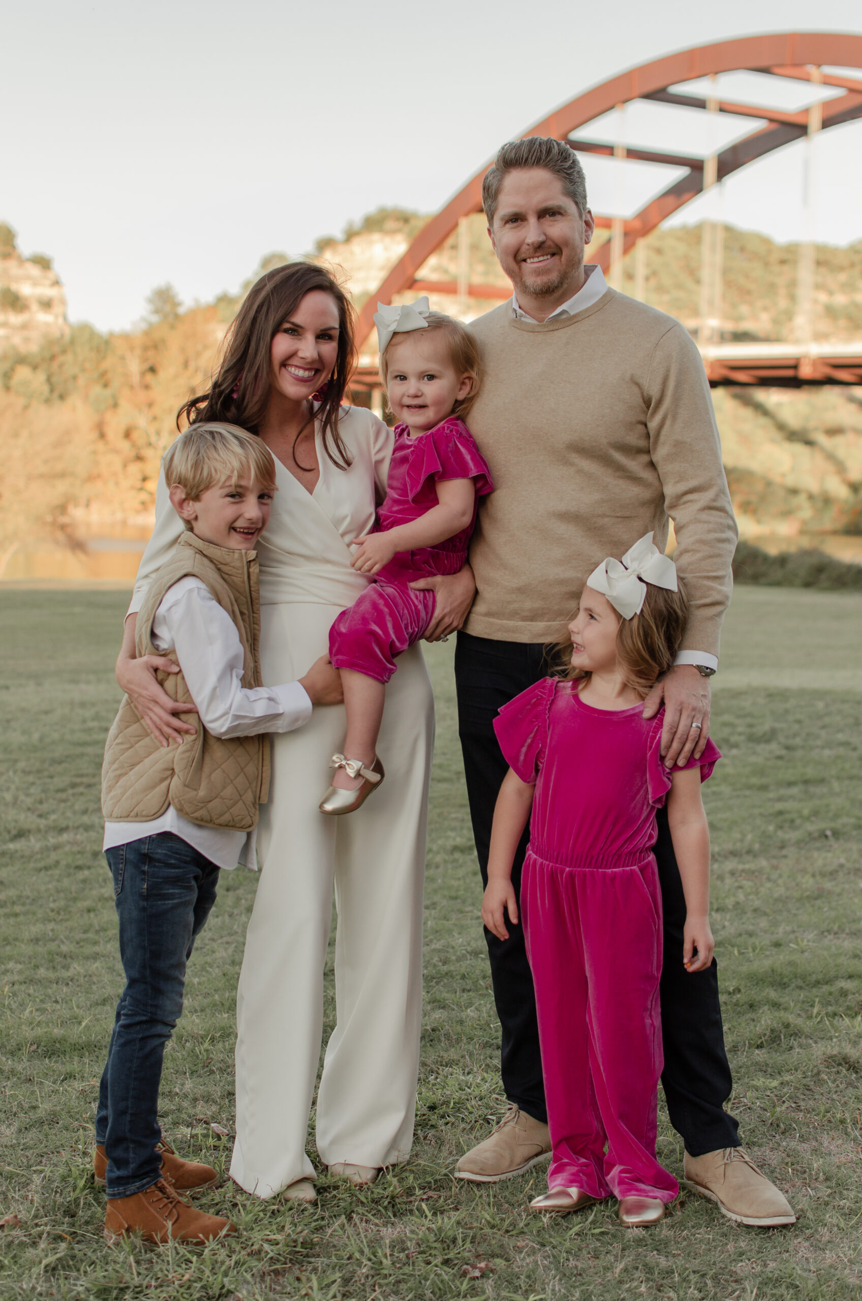 family in front of the penny backer bridge in Westlake Austin Texas