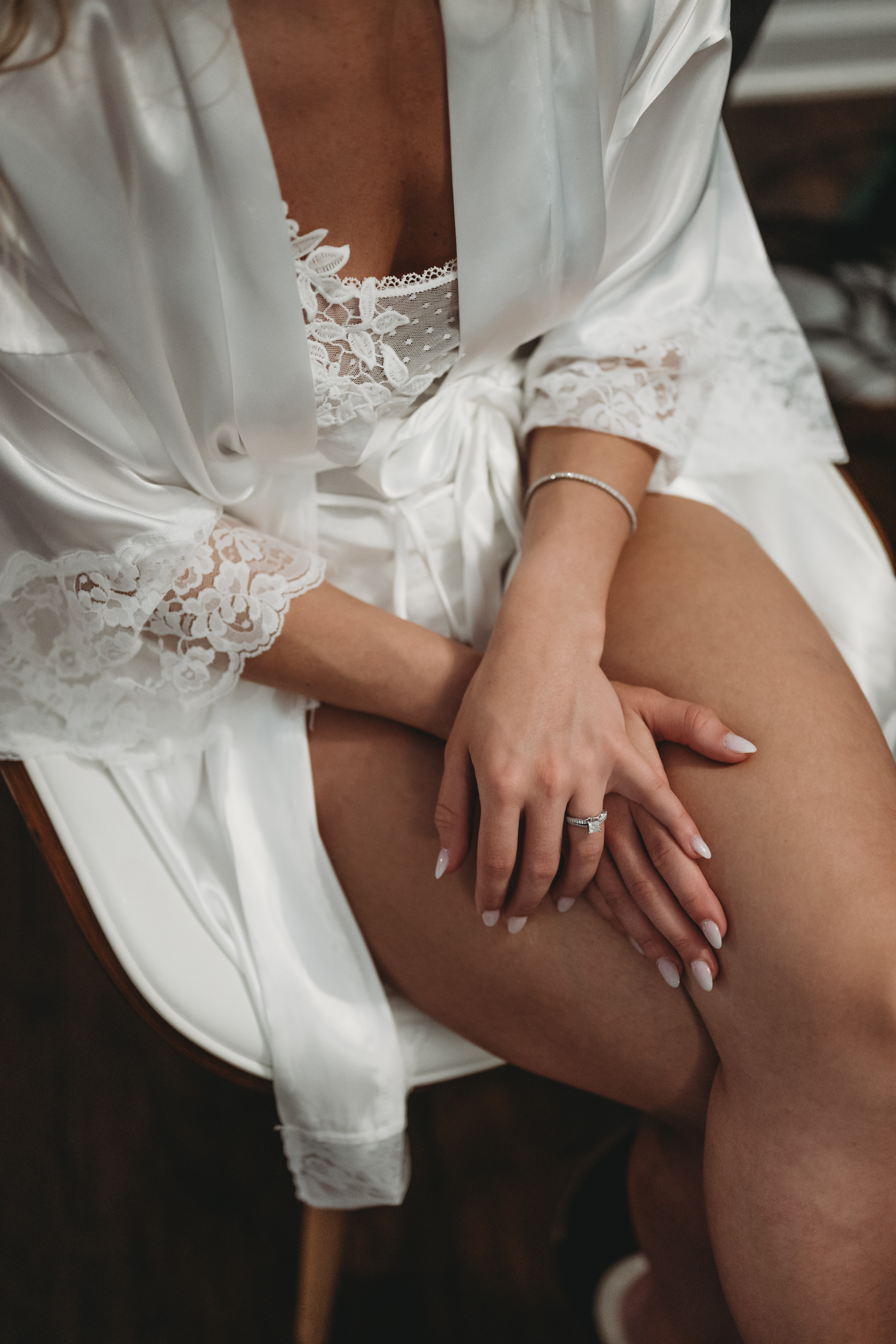 close up bridal detail shot of bride pajamas and jewelry on wedding day