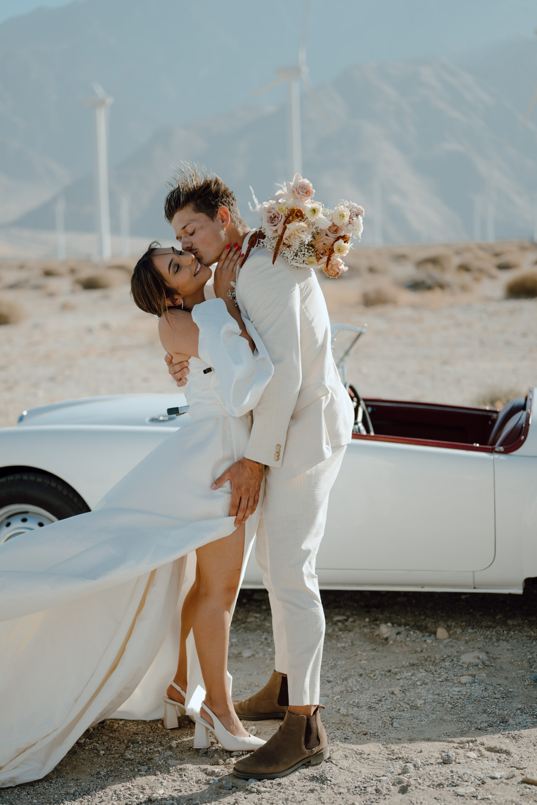 bride and groom hugging